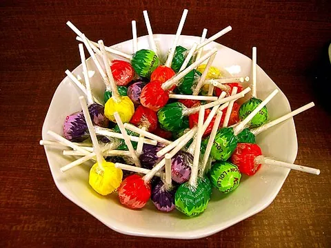 lollipop: an item of confectionery consisting of a piece of candy or sweet attached to a stick