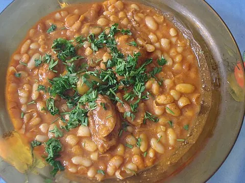 loubia: a North African bean stew, typically made with white beans, tomatoes, spices, and sometimes meat,...