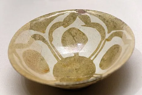 lusterware: a type of pottery having an iridescent metallic glaze
