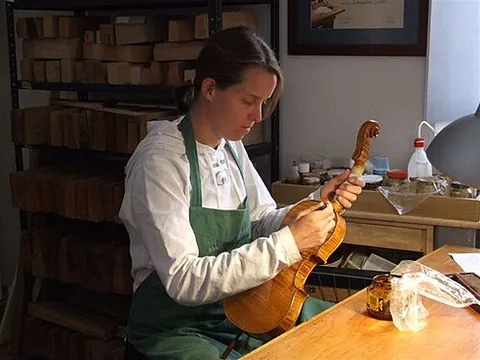 luthier: a person who, or a business which, makes or repairs stringed wooden musical instruments, such as...