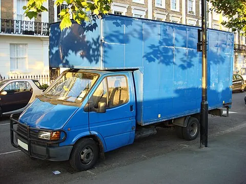 luton van: a box van with a body which extends over the cab