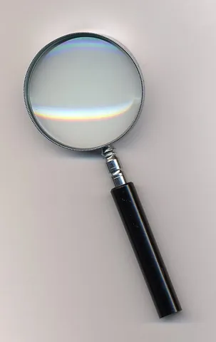 magnifying glass: an instrument made of convex glass, used to magnify