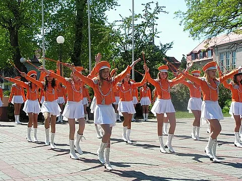 majorette: a female dancer who twirls and performs stunts with a lightweight baton, whether as a solo, in a...