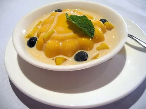 mango pudding: a pudding made with agar or gelatin, mango or mango essence, evaporated milk and sugar, of Indian...