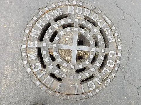 manhole: a hole in the ground used to access the sewers or other underground vaults and installations