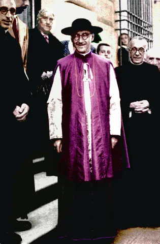 mantelletta: a sleeveless, knee-length vestment open at the front which is worn by Roman Catholic prelates
