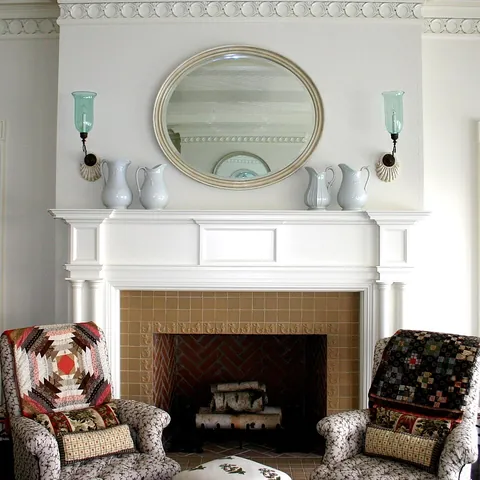 mantelpiece: a shelf that is affixed to the wall above a fireplace