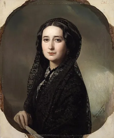 mantilla: a lace veil of Spanish origin worn over a woman's hair and shoulders