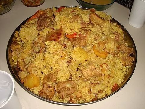 maqluba: a traditional Levantine dish of meat, rice, and fried vegetables, cooked in a pot which is then...