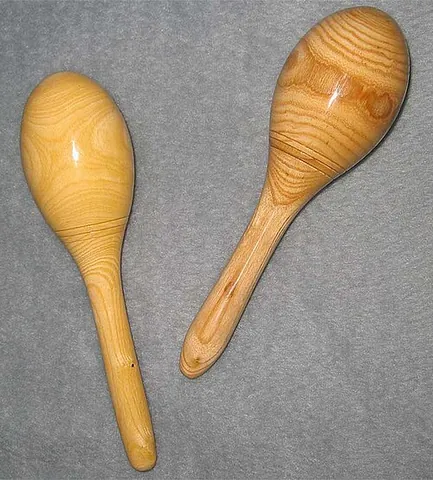 maraca: a Latin American percussion instrument consisting of a hollow-gourd rattle containing pebbles or...