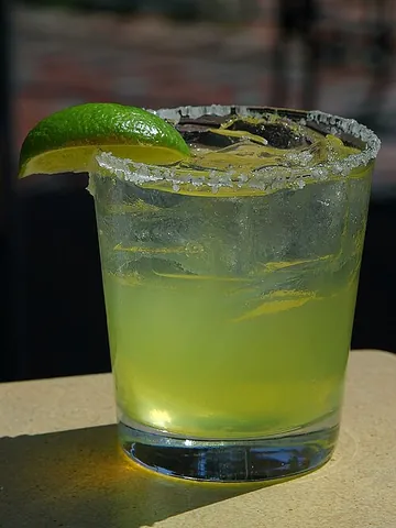margarita: a cocktail made with tequila, an orange-flavoured liqueur, and lemon or lime juice, often served...