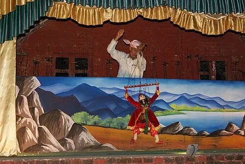 marionette: a puppet, usually made of wood, which is animated by the pulling of strings