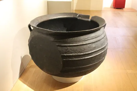 marmite: a rounded cooking pot of various designs, commonly pot-bellied, with or without tripod, handles,...