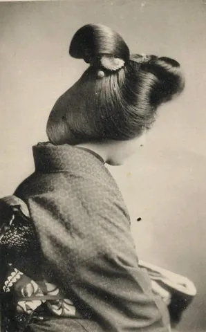 marumage: a round knotted hairstyle traditionally worn by married women in Japan