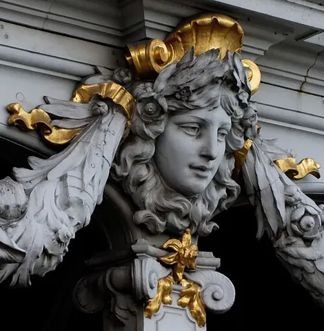 mascaron: a carved, ornamental face, either human-like or grotesque, whose alleged function was originally to...