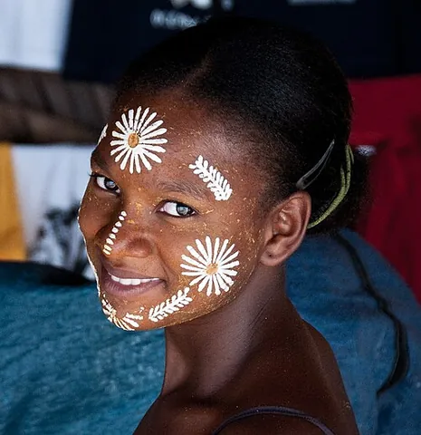 masonjoany: a cosmetic paste and sunscreen worn as a protective and decorative mask by women and girls in...