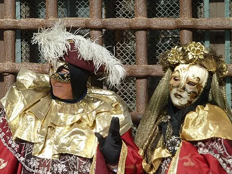 masquerade: an assembly or party of people wearing (usually elaborate or fanciful) masks and costumes, and...