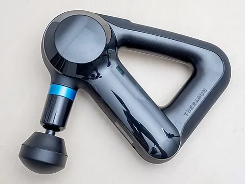 massage gun: a vibrating hand-held device for massaging the muscles of the body