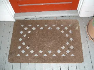 mat: a flat piece of coarse material used for wiping one’s feet, or as a decorative or protective floor...