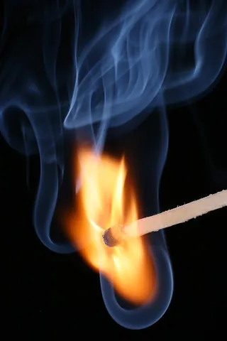 matchstick: a small, slender piece of wood or cardboard serving as a component of a match