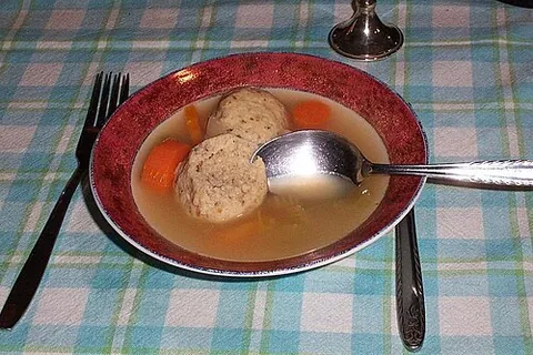 matzo ball: a ball of unleavened dough, often served in soup in Jewish culture