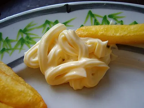 mayonnaise: a dressing made from vegetable oil, raw egg yolks, vinegar or lemon juice, and seasoning, used on...