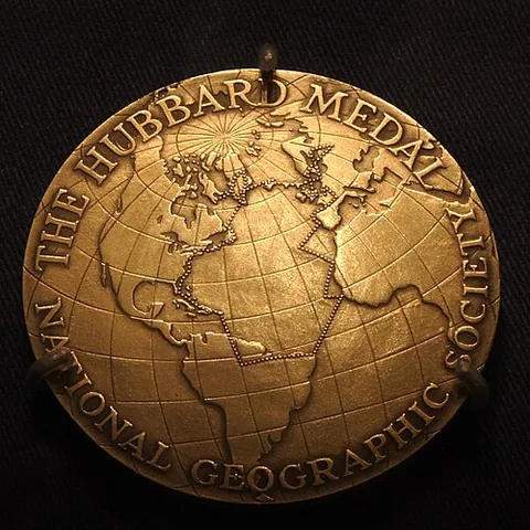 medal: a stamped metal disc used as a personal ornament, a charm, or a religious object