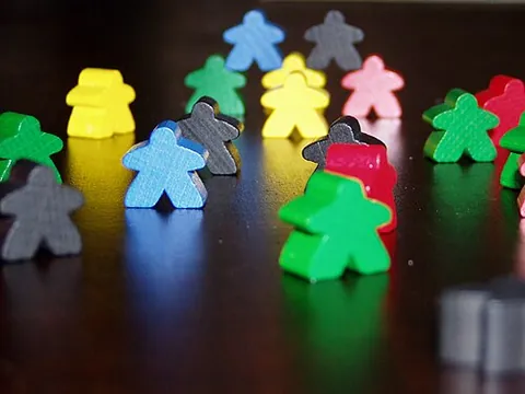 meeple: a small person-shaped figure used as a player's token in a board game
