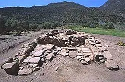 megaron: the rectangular great hall in a Mycenaean building, usually supported with pillars