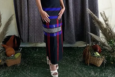 mekhela: a traditional garment worn by Assamese women, consisting of a length of cloth worn (typically with...