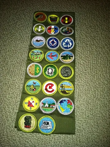merit badge: an embroidered cloth patch awarded to a youth member of the Boy Scouts of America or other scouting...