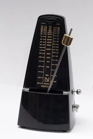 metronome: a device, containing an inverted pendulum, used to mark time by means of regular ticks at...