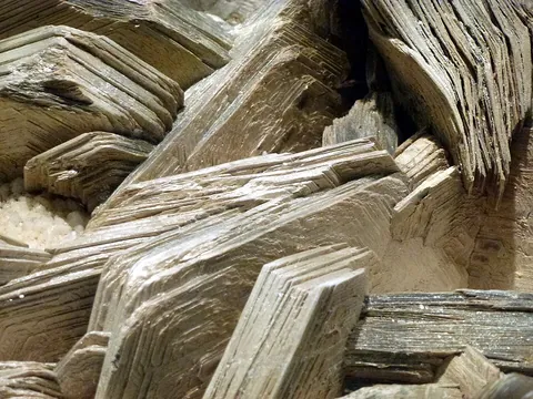 mica: any of a group of hydrous aluminosilicate minerals characterized by highly perfect cleavage, so...