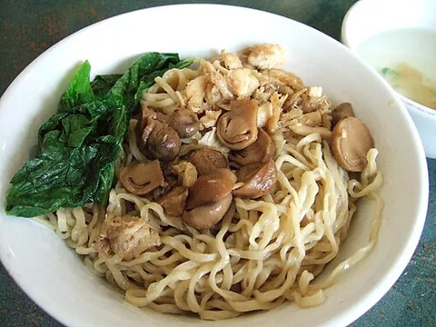 mie ayam: an Indonesian dish of seasoned yellow wheat noodles topped with diced chicken