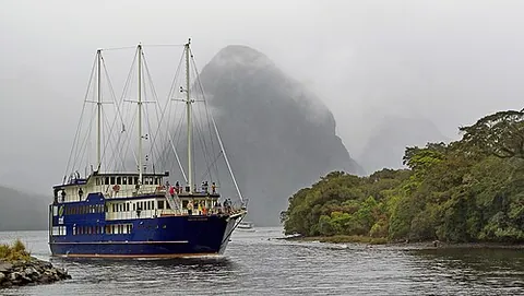 milford sound: a fiord and small village in Fiordland, Southland region, south-west New Zealand, a popular tourist...