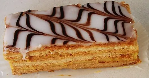 mille-feuille: a type of pastry made of several layers of puff pastry usually filled with cream or custard, and...