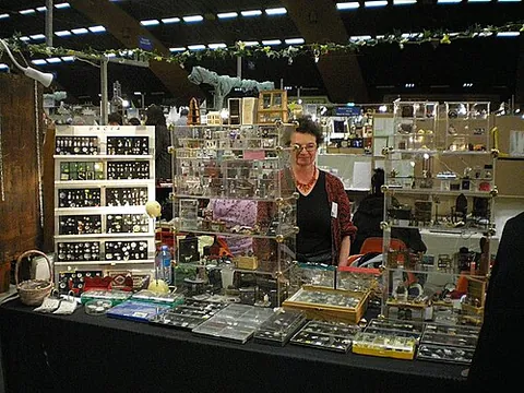 miniac: a producer or collector of miniatures, being small-scale replicas of contemporary or historical...