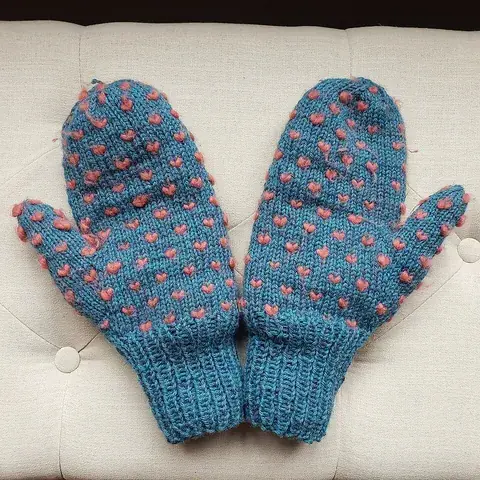 mitten: a type of glove or garment that covers a hand with a separate sheath for the thumb, but not for...