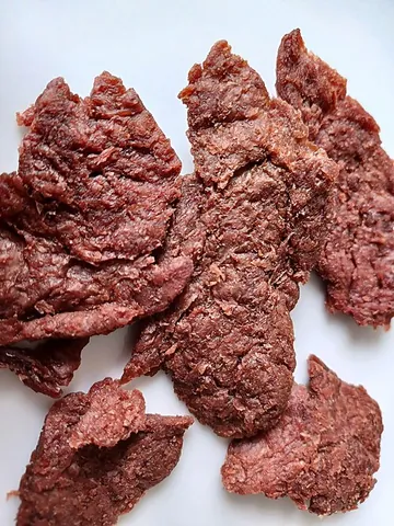 mock meat: a type of vegetarian processed food, often containing soy, gluten, and vegetables, shaped and...