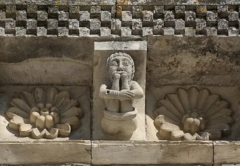 modillion: a decoratively carved supporting block atop a column, often underneath a cornice, and usually...