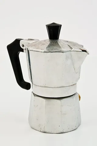 moka pot: a coffeemaker that produces coffee by passing boiling water pressurized by steam through ground...