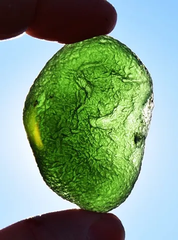 moldavite: a substance formed by meteorite impact, a component of the tektites found across central Europe