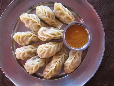 momo: a type of dumpling, typical of the cuisines of Nepal, Ladakh, and Tibet and also regionally popular...