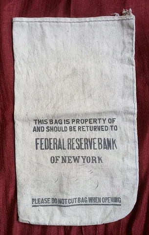 money bag: a bag, normally with a drawstring, used for holding money