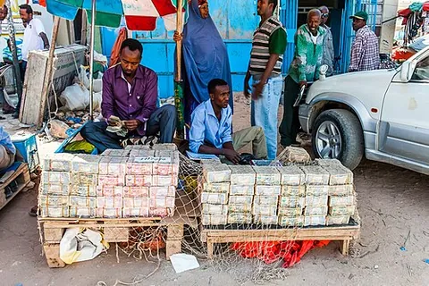 money changer: a person who will exchange currency of one type for another for a fee or percentage