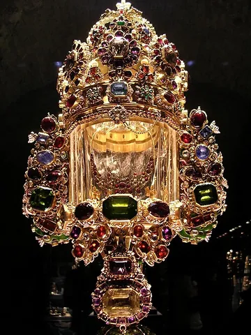 monstrance: an ornamental, often precious receptacle, either open or with a transparent cover, in which the...