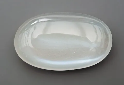 moonstone: a translucent gemstone, an orthoclase feldspar, that has a pearly lustre