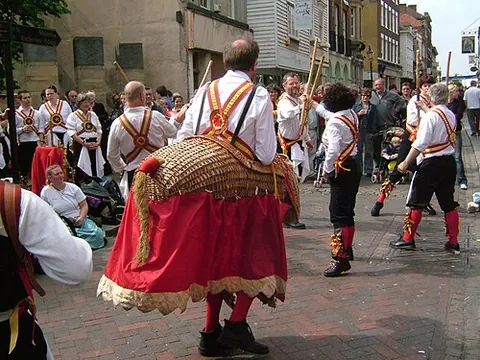 morris dance: a traditional English folk dance performed by a team of costumed dancers, often men but also men...