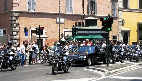 motorcade: a procession of cars carrying VIPs, especially political figures