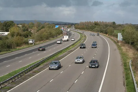 motorway: a highway with grade-separated crossings (rather than level crossings) and designed (and only...